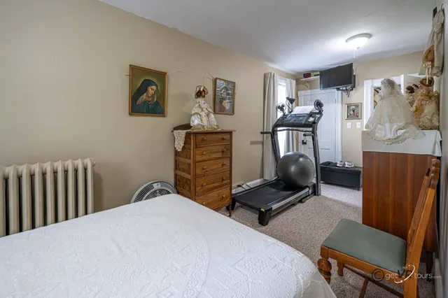 a bedroom with a bed and furniture