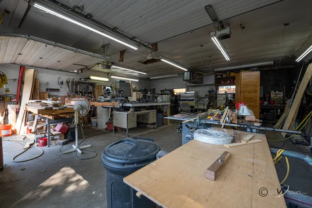 a view of backyard of house with green space