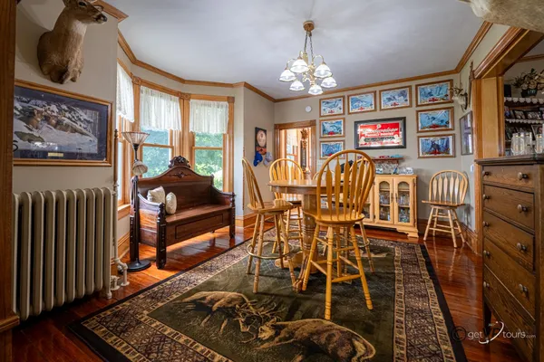 a view of a dining room with furniture window and wooden floor