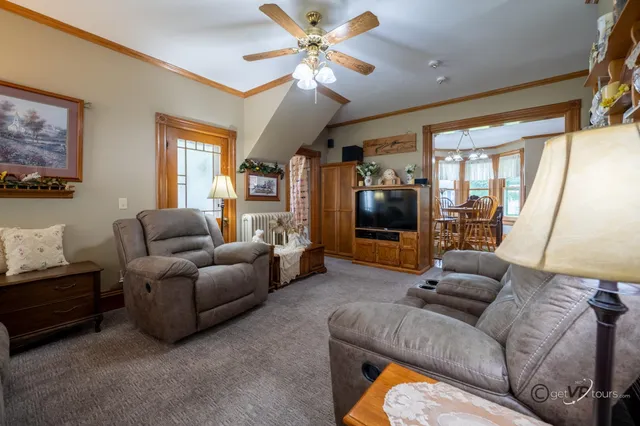 a living room with furniture and a flat screen tv
