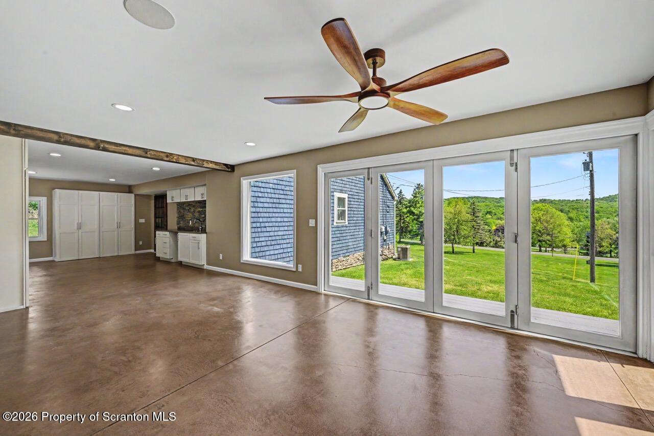 457 Craig Road Dalton, PA 18414 - Photo 51 of 114 a view of a livingroom with a ceiling fan and window