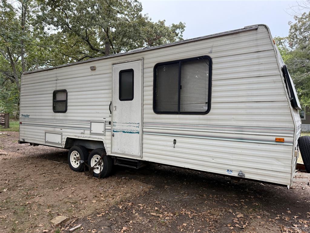 1046 East Owings Street Denison, TX 75021 - Photo 7 of 7 a white house with a outdoor space