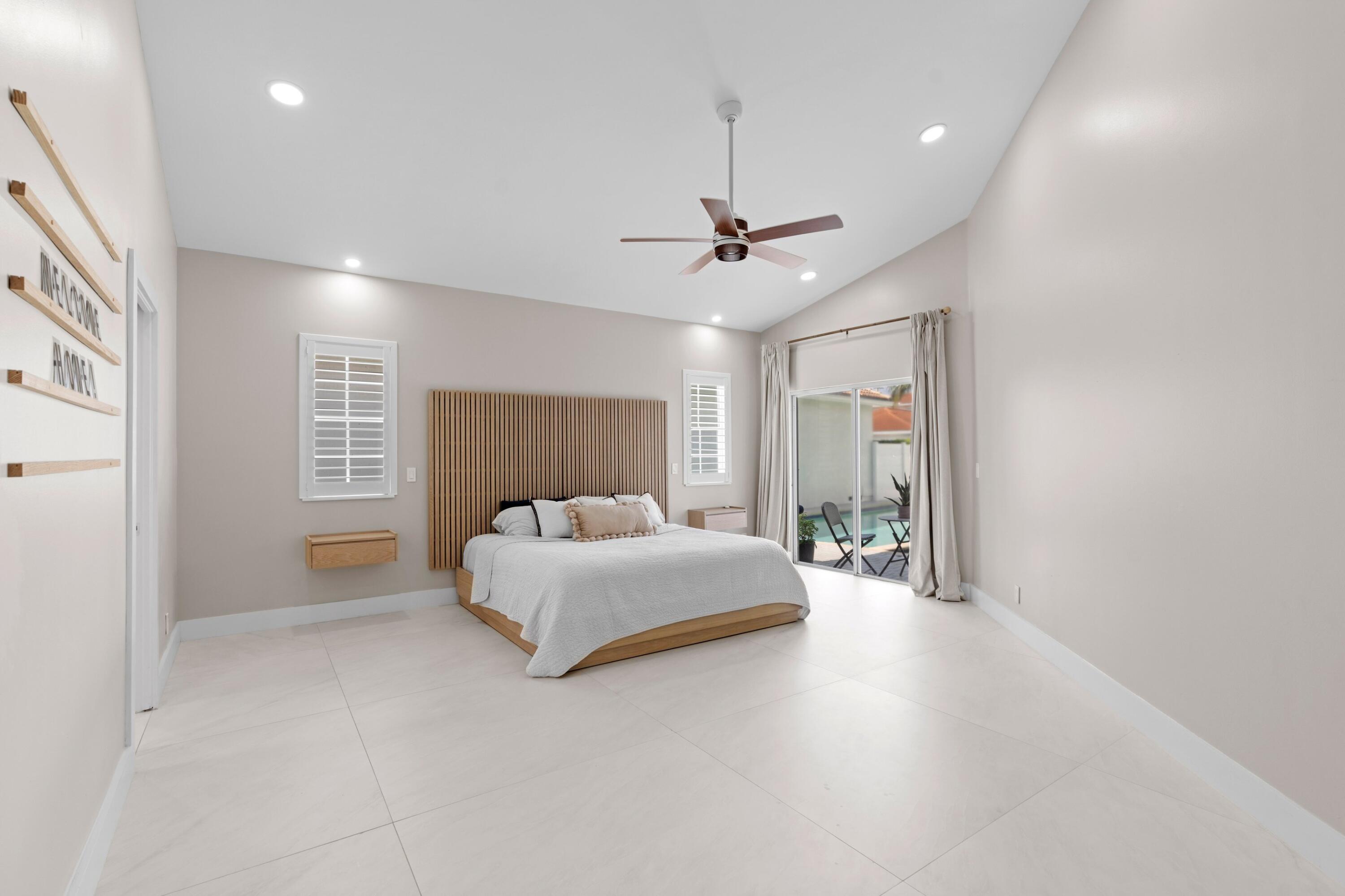 7140 Northwest Turtle Walk Boca Raton, FL 33487 - Photo 14 of 49 Primary Bedroom