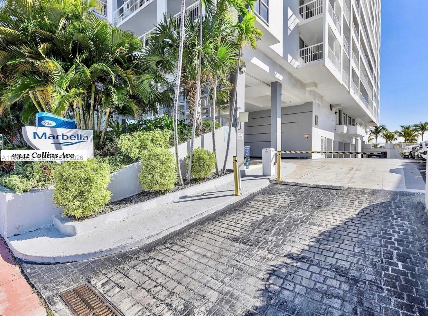 9341 Collins Avenue, Unit 503 Surfside, FL 33154 - Photo 19 of 35 a view of a chair and table in the backyard