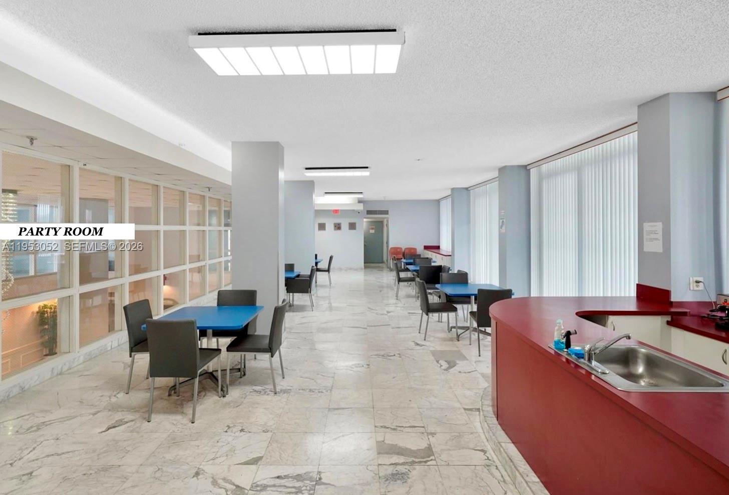 9341 Collins Avenue, Unit 503 Surfside, FL 33154 - Photo 22 of 35 a dining room with furniture and window