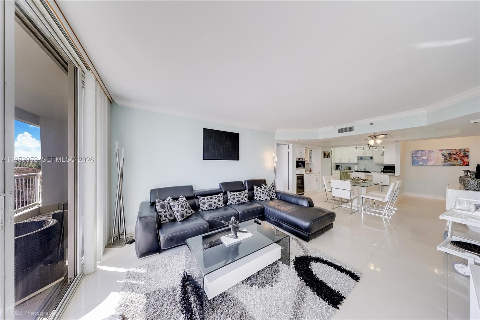 9341 Collins Avenue, Unit 503 Surfside, FL 33154 - Photo 3 of 35 a living room with furniture