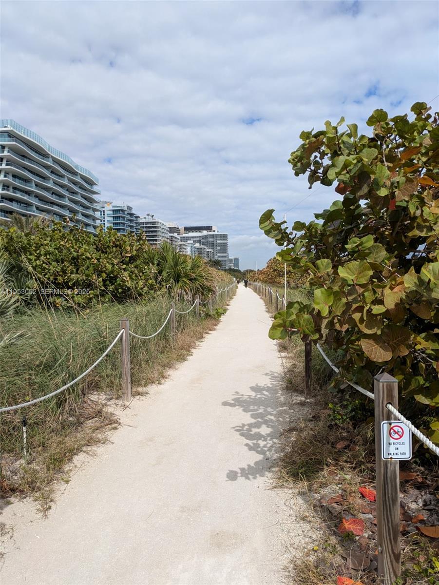 9341 Collins Avenue, Unit 503 Surfside, FL 33154 - Photo 34 of 35 a view of a yard with wooden fence