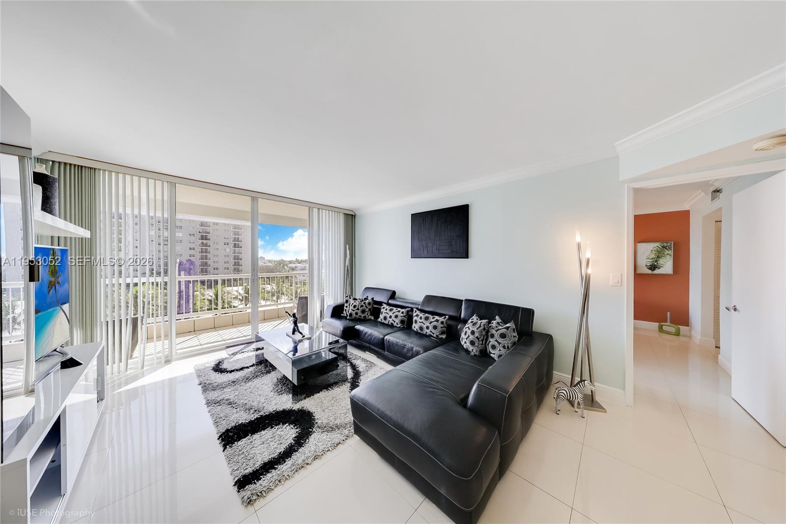9341 Collins Avenue, Unit 503 Surfside, FL 33154 - Photo 4 of 35 a living room with furniture and a large window