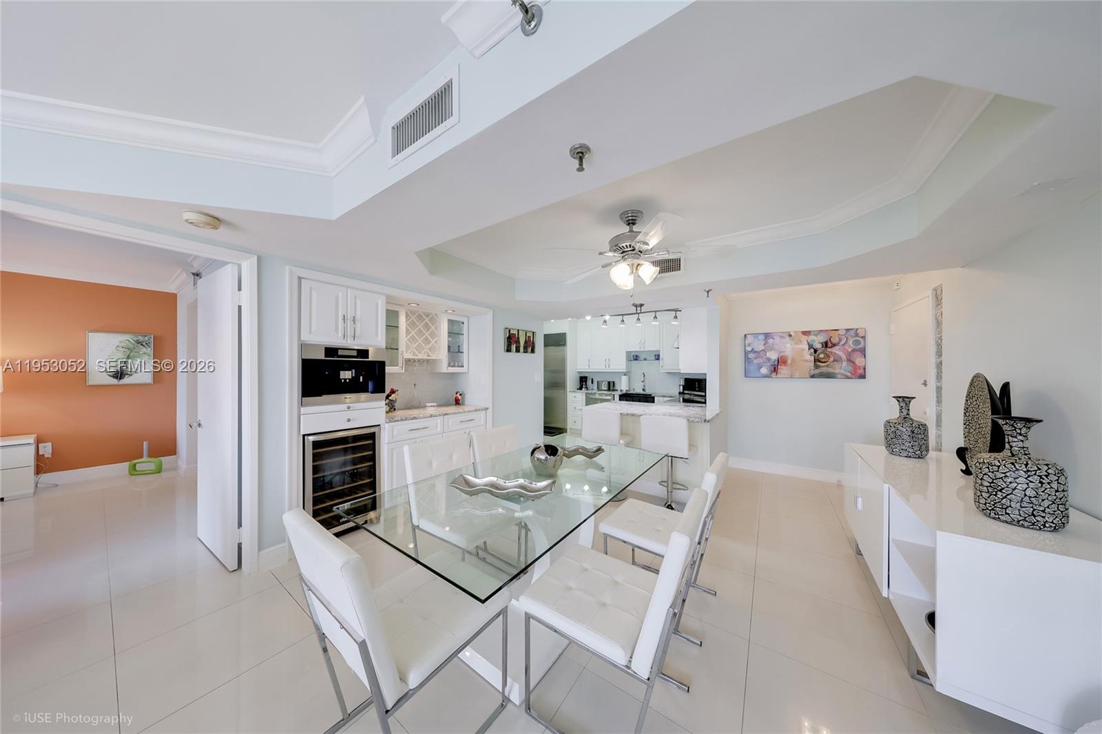 9341 Collins Avenue, Unit 503 Surfside, FL 33154 - Photo 5 of 35 a living room with furniture and kitchen view