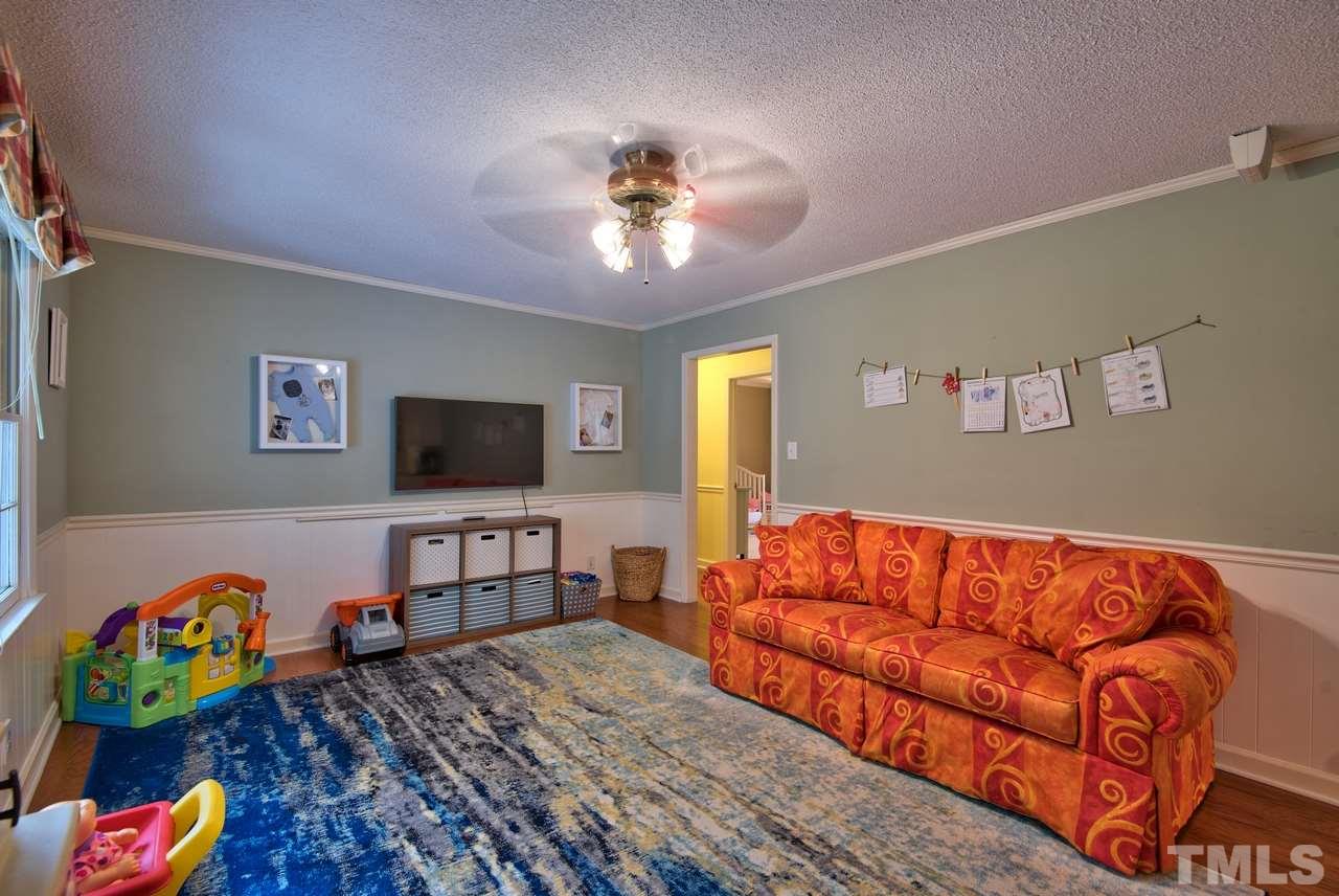 208 Latta Road Durham, NC 27712 - Photo 14 of 25 The Living Room is currently being used as a play room. Toys do no convey.