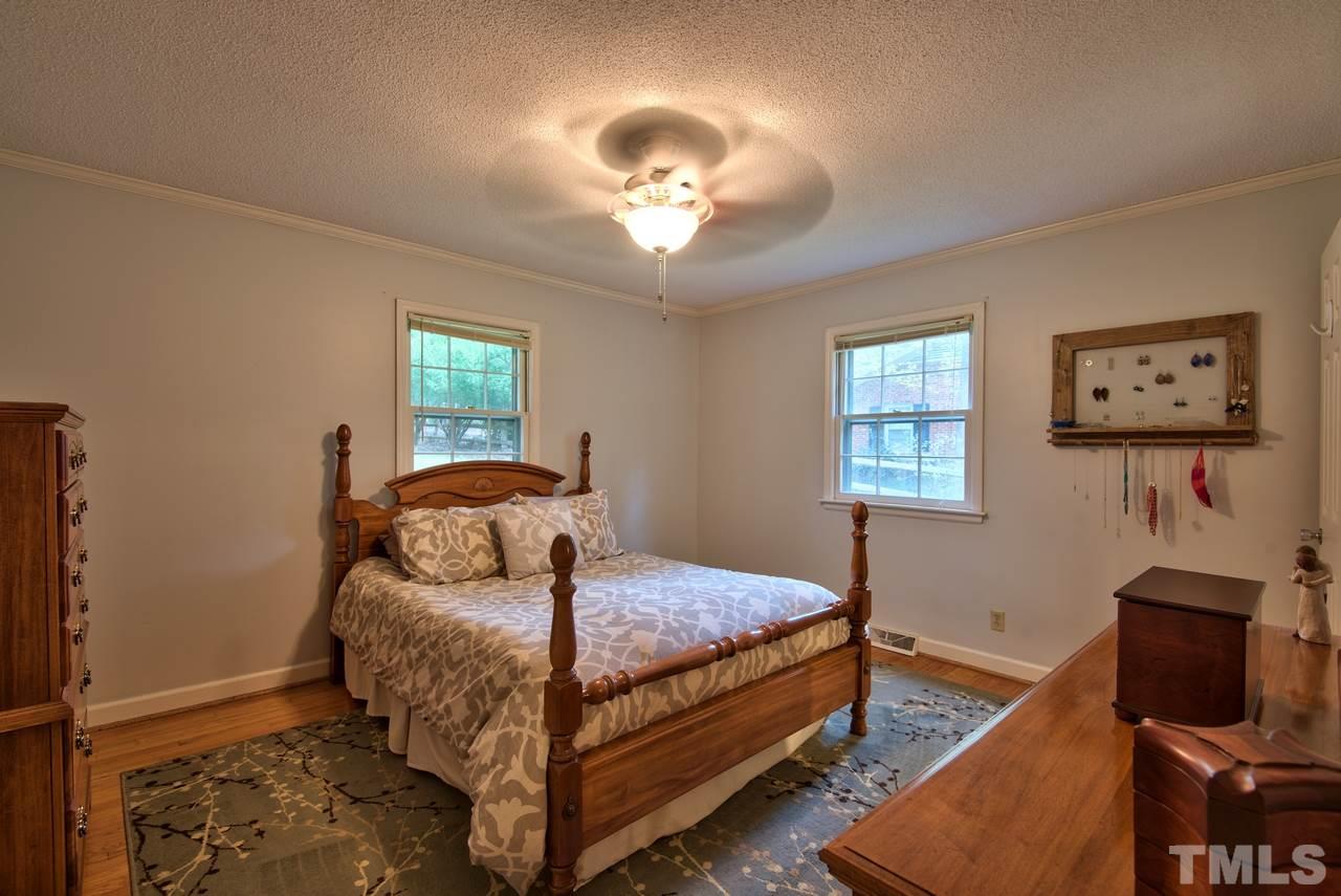 208 Latta Road Durham, NC 27712 - Photo 15 of 25 The Master Bedroom has a soothing color palette and gleaming hardwood floors.