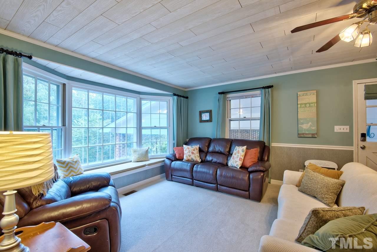 208 Latta Road Durham, NC 27712 - Photo 5 of 25 The Family Room flows between the Kitchen and Dining Room. Neutral colors and decor make this a great space to entertain.