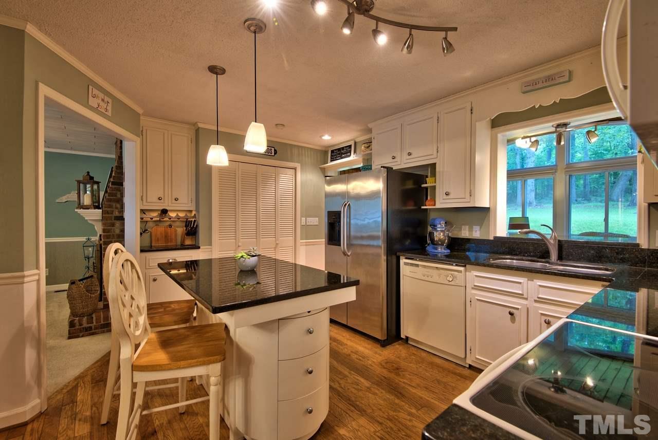 208 Latta Road Durham, NC 27712 - Photo 10 of 25 You will love that the Kitchen opens to the Dining Room, Family Room, Sun Room and Living Room. After all, the kitchen is the heart of the home.