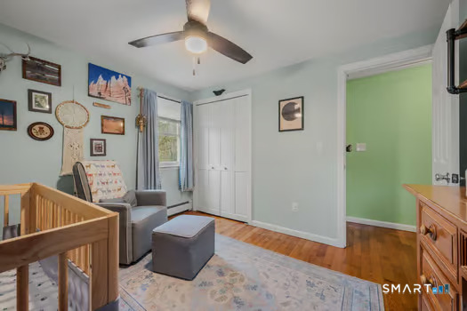9 Thompson Road Franklin, CT 06254 - Photo 16 of 30 a living room with furniture and a wooden floor