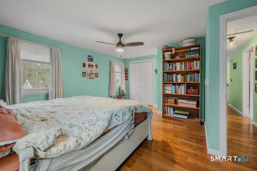 9 Thompson Road Franklin, CT 06254 - Photo 18 of 30 a bedroom with bed and a book shelf
