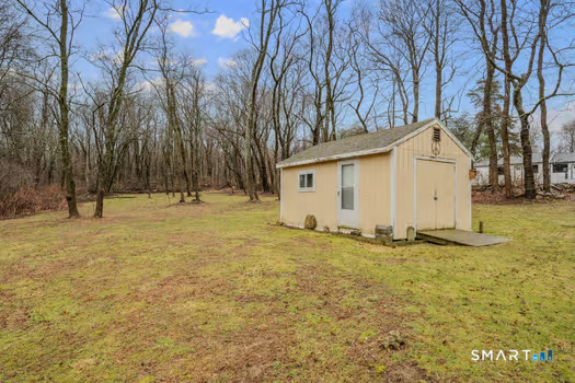 9 Thompson Road Franklin, CT 06254 - Photo 27 of 30 a view of a backyard with large trees