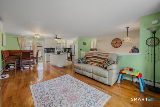 9 Thompson Road Franklin, CT 06254 - Photo 4 of 30 a living room with furniture and wooden floor