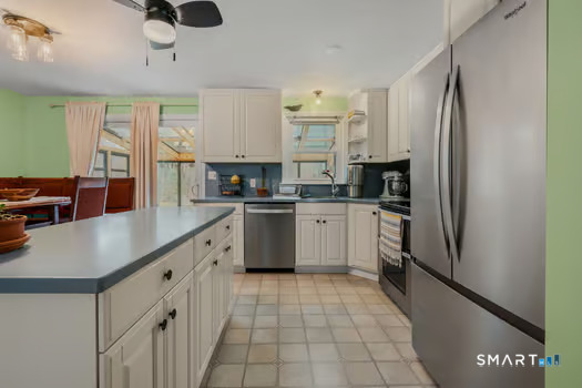 9 Thompson Road Franklin, CT 06254 - Photo 8 of 30 a kitchen with stainless steel appliances a sink stove refrigerator and cabinets