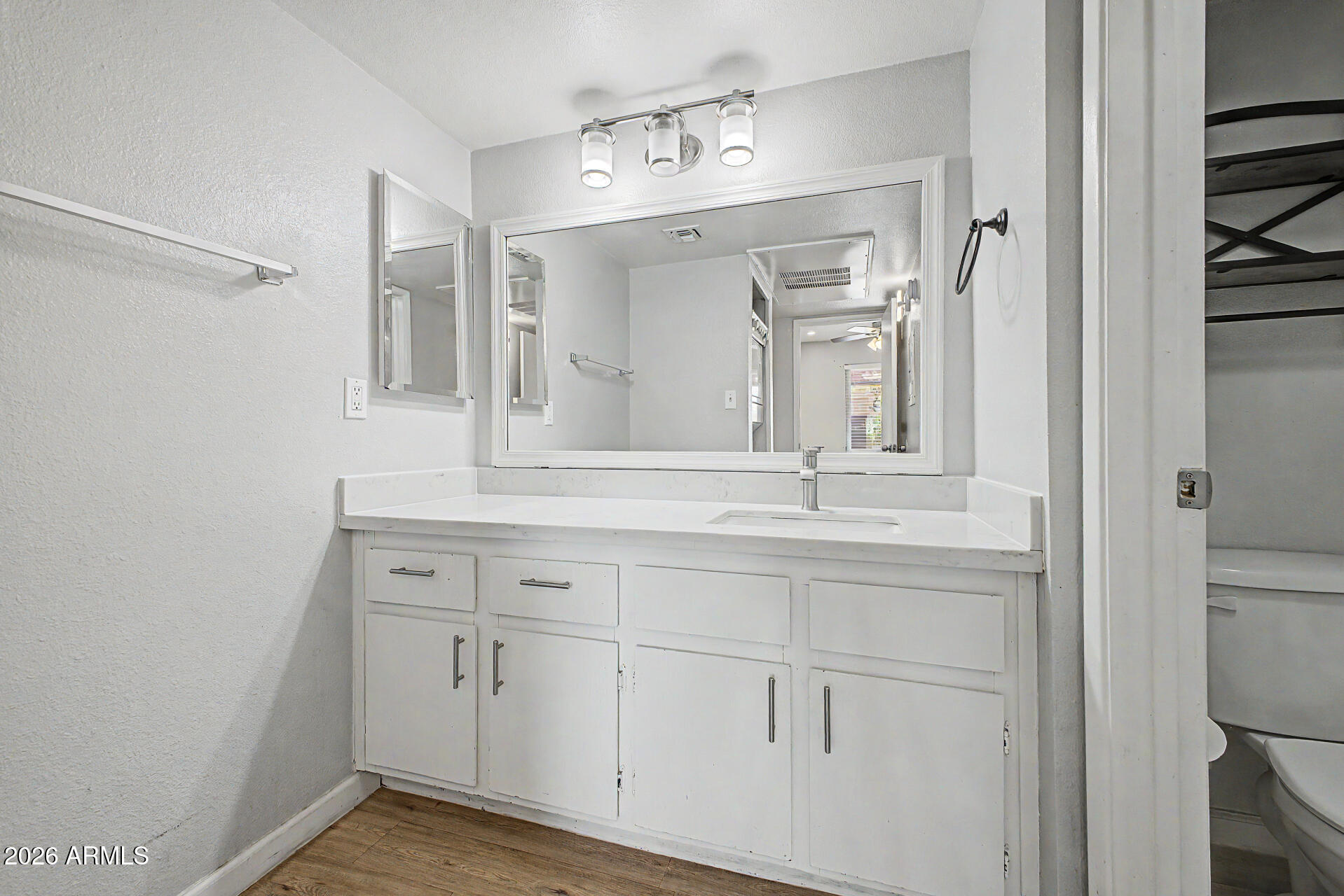 2625 East Indian School Road, Unit 227 Phoenix, AZ 85016 - Photo 17 of 31 a bathroom with a sink and a mirror