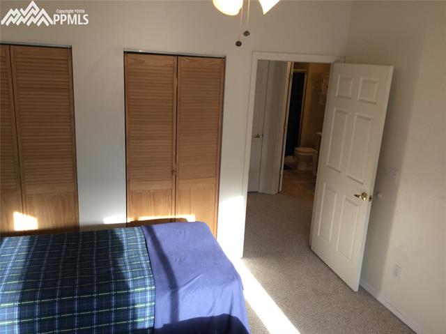 2095 Legacy Ridge View, Unit 112 Colorado Springs, CO 80910 - Photo 13 of 28 View from master looking towards main level bath. Too the left would be the secondary bedroom.