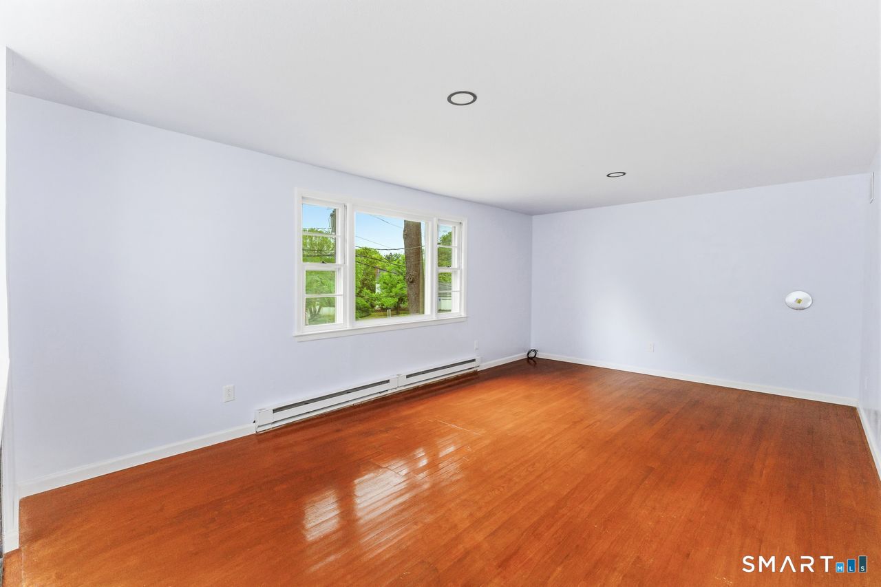 17 Rhoda Lane Bristol, CT 06010 - Photo 4 of 22 an empty room with a window