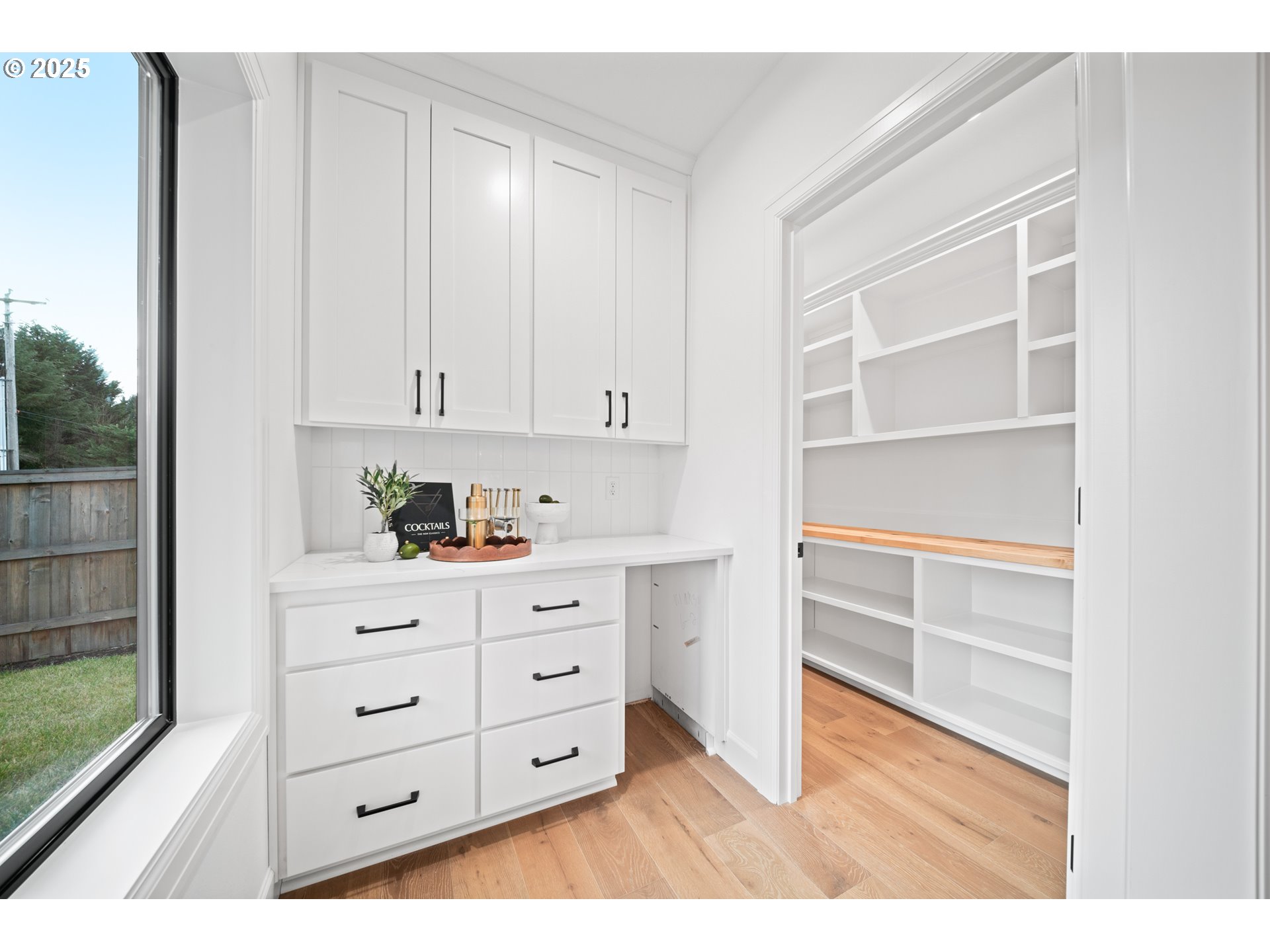 1211 Northwest 150th Street Vancouver, WA 98685 - Photo 13 of 23 a kitchen with white cabinets and window