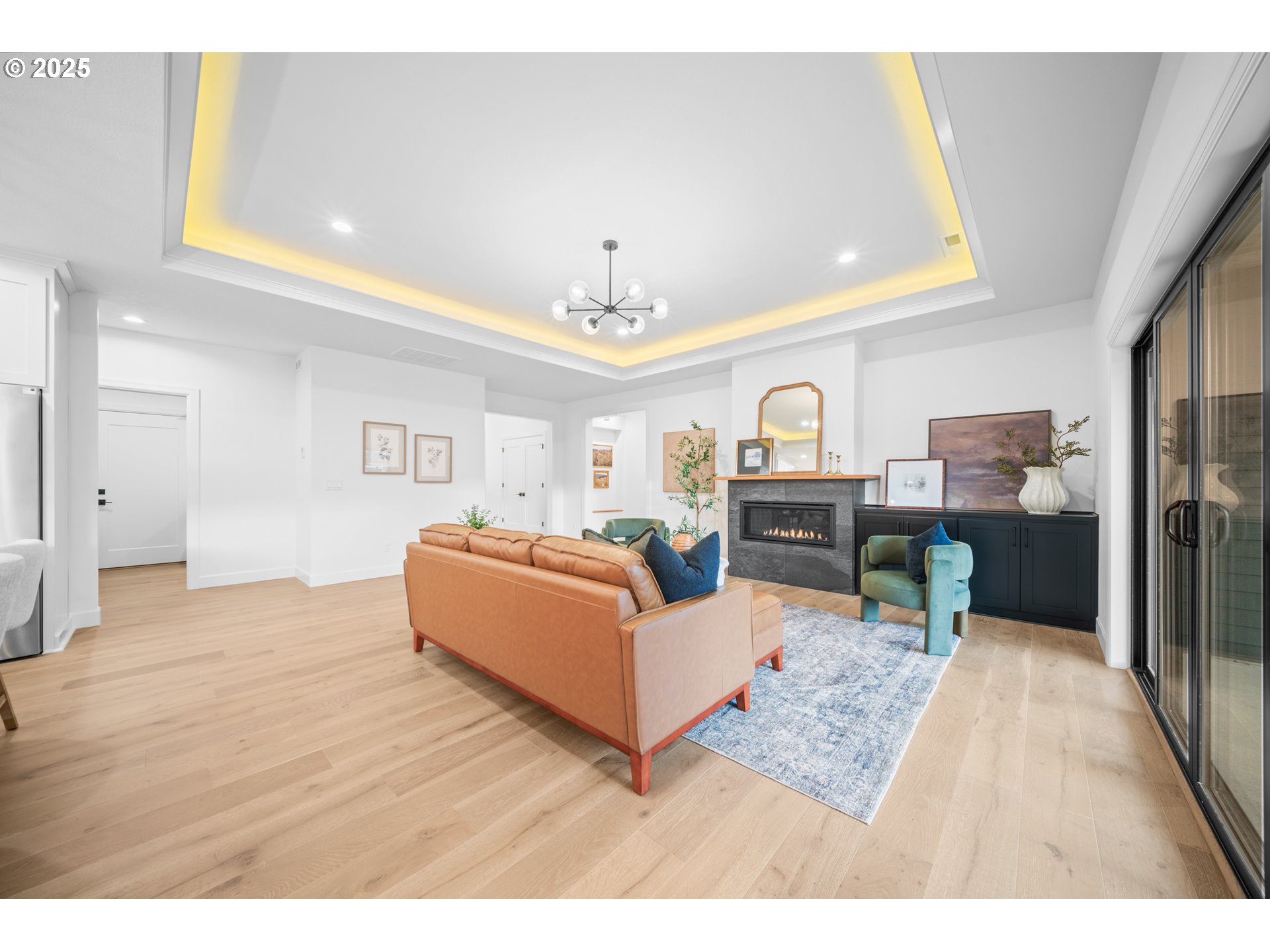 1211 Northwest 150th Street Vancouver, WA 98685 - Photo 6 of 23 a living room with furniture and a chandelier