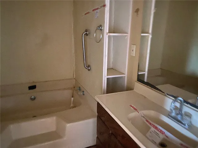 a bathroom with a sink and a shower