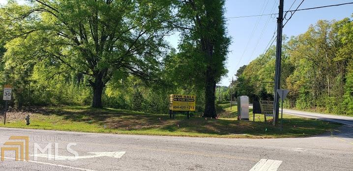 a view of a park that has large trees