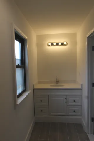 a bathroom with a sink and mirror