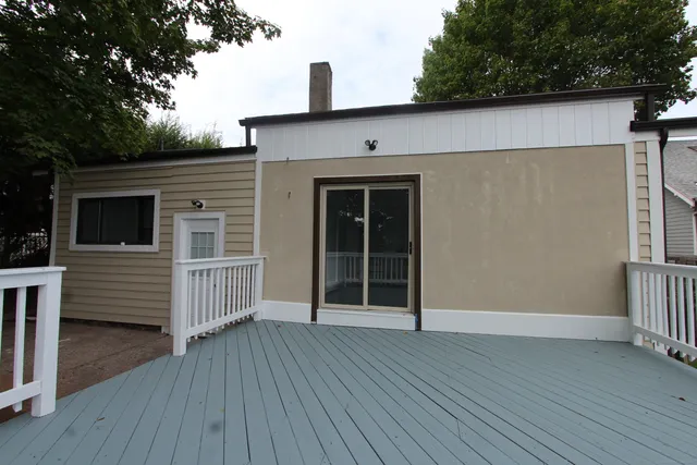 a view of front door and wooden floor