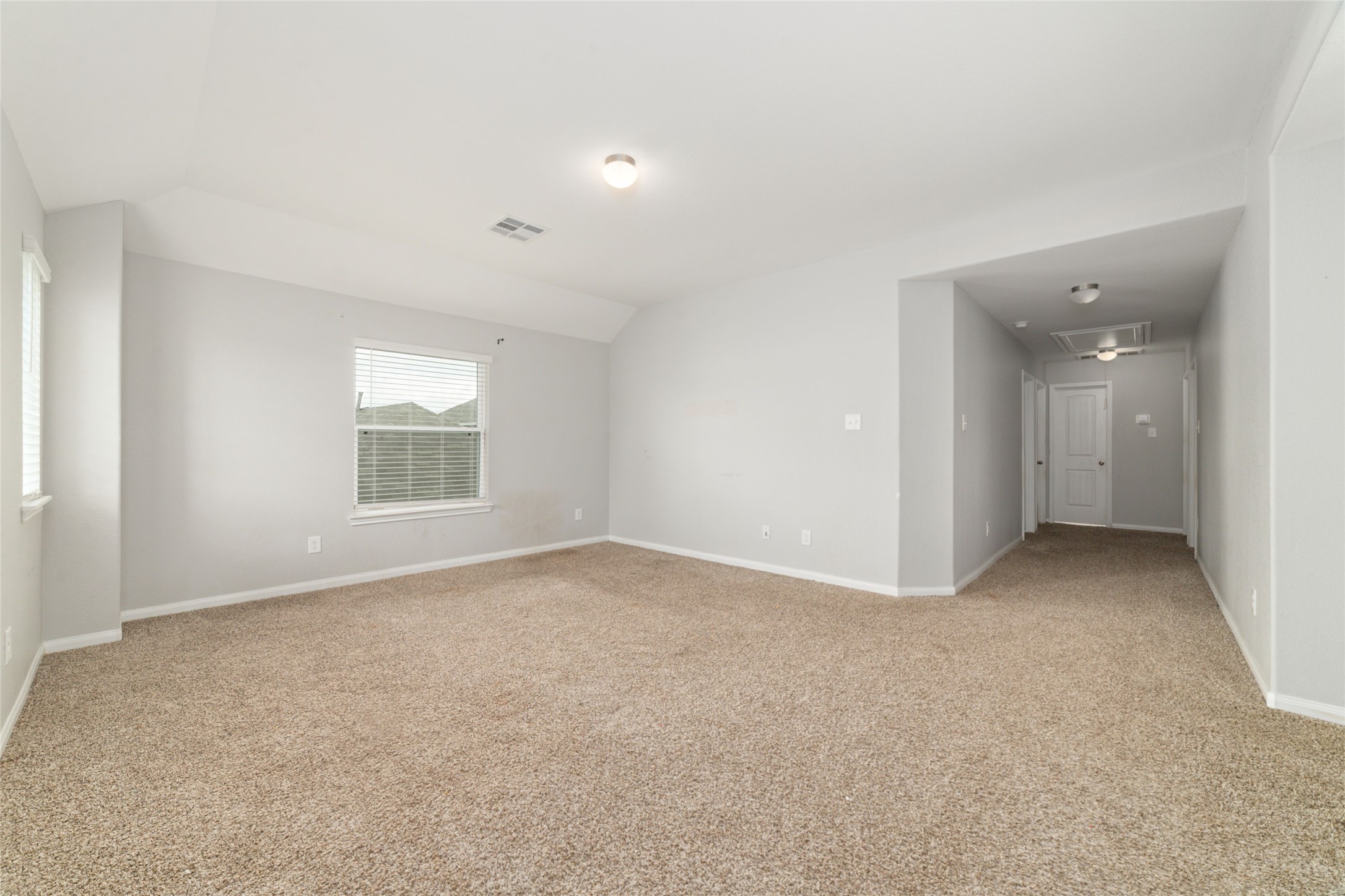 2209 Raider Drive Conroe, TX 77301 - Photo 18 of 27 an empty room with windows