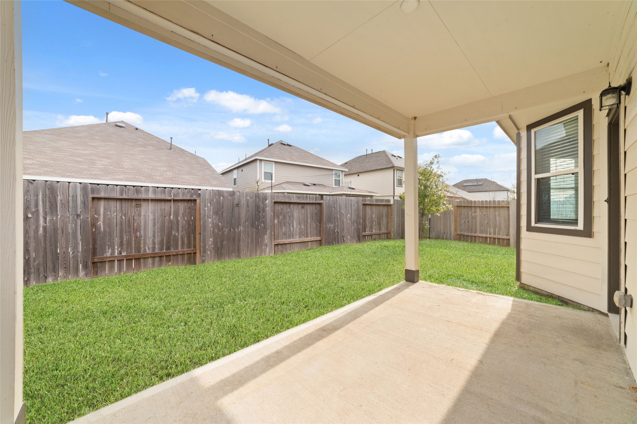 2209 Raider Drive Conroe, TX 77301 - Photo 26 of 27 a view of a house with backyard and a garden