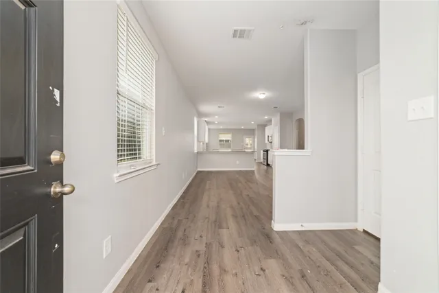 a view of a kitchen from the hallway