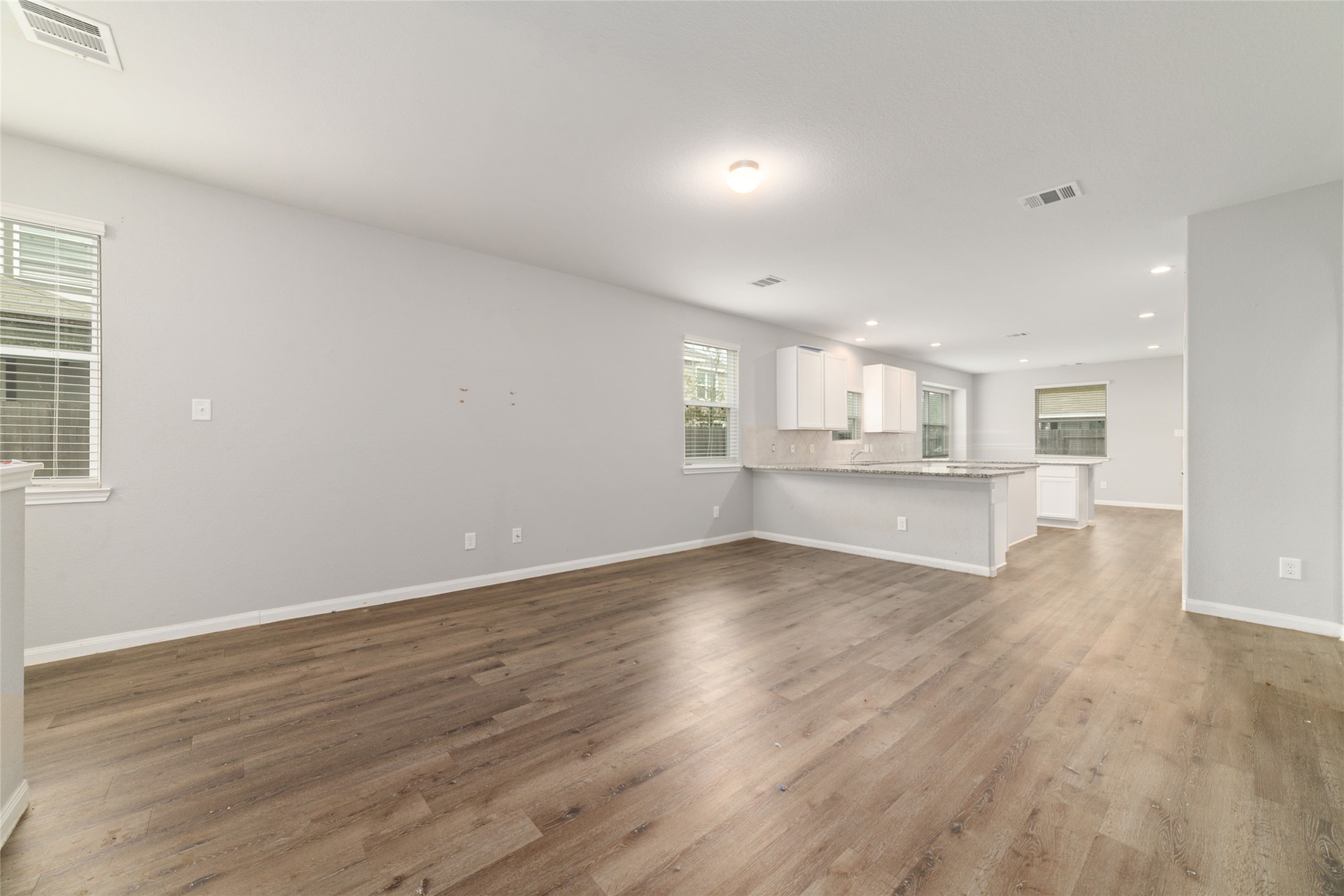 2209 Raider Drive Conroe, TX 77301 - Photo 5 of 27 a view of kitchen with wooden floor