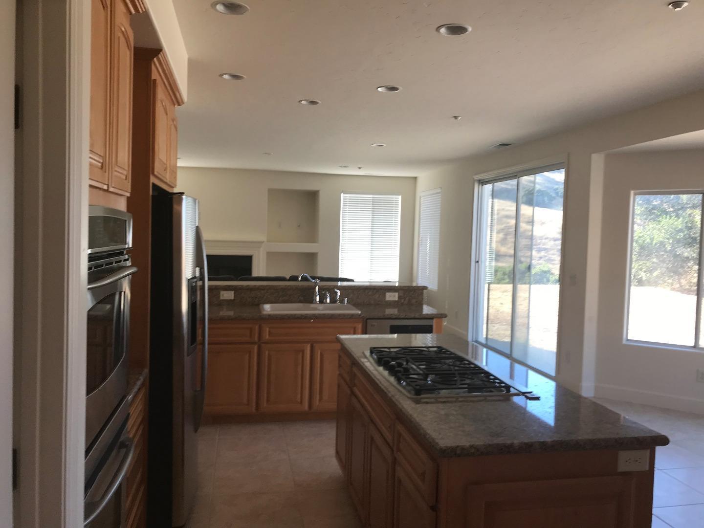 27860 Crowne Point Drive Salinas, CA 93908 - Photo 11 of 50 a kitchen with a stove a refrigerator and a stove