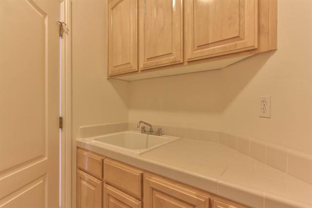 27860 Crowne Point Drive Salinas, CA 93908 - Photo 29 of 50 a bathroom with a sink and cabinets