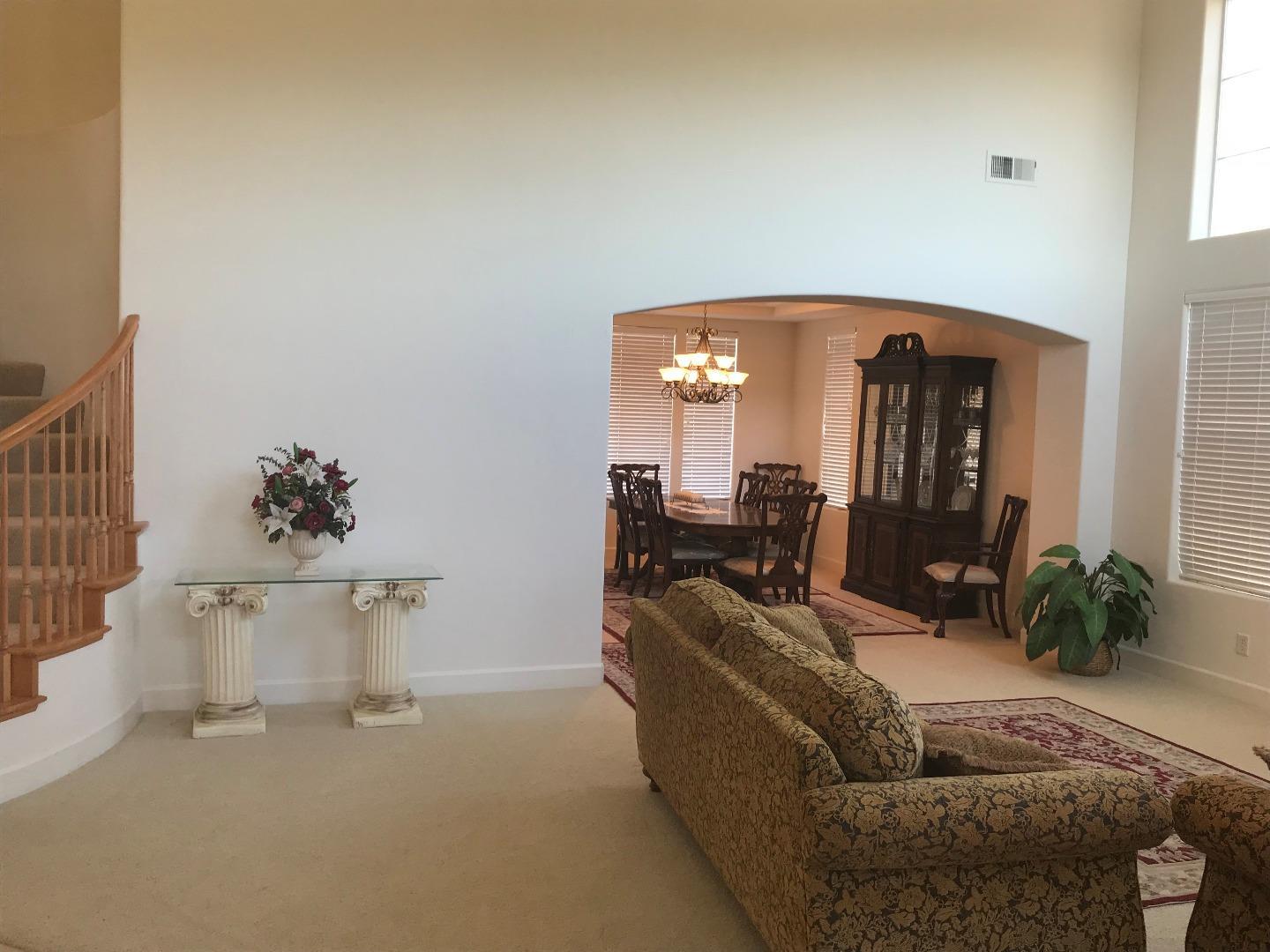 27860 Crowne Point Drive Salinas, CA 93908 - Photo 4 of 50 a living room with furniture and a mirror