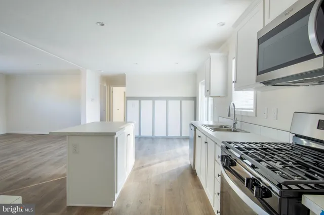 a kitchen with a stove and a sink