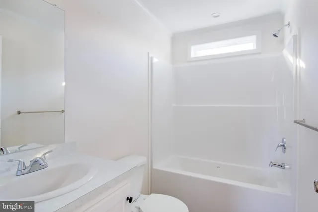 a bathroom with a bathtub and a sink