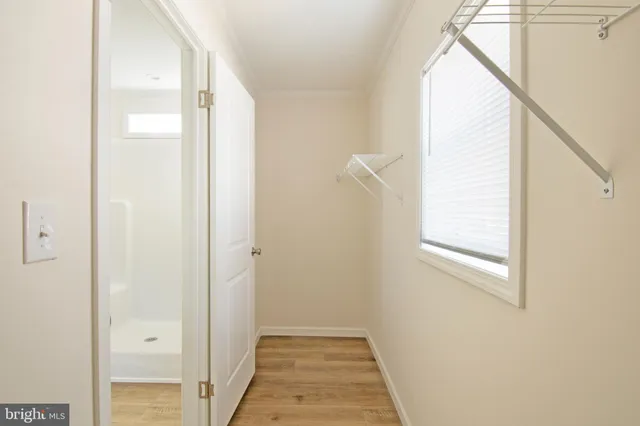 a view of a hallway with a window