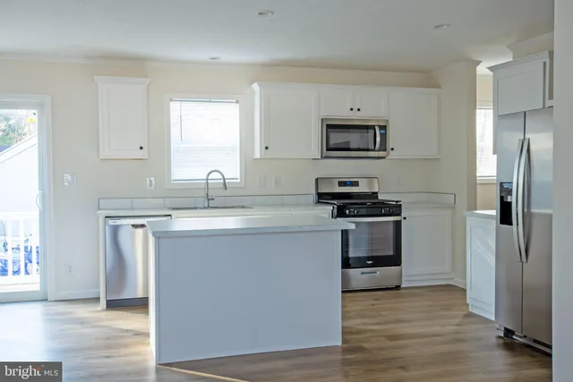a kitchen with a sink and a stove