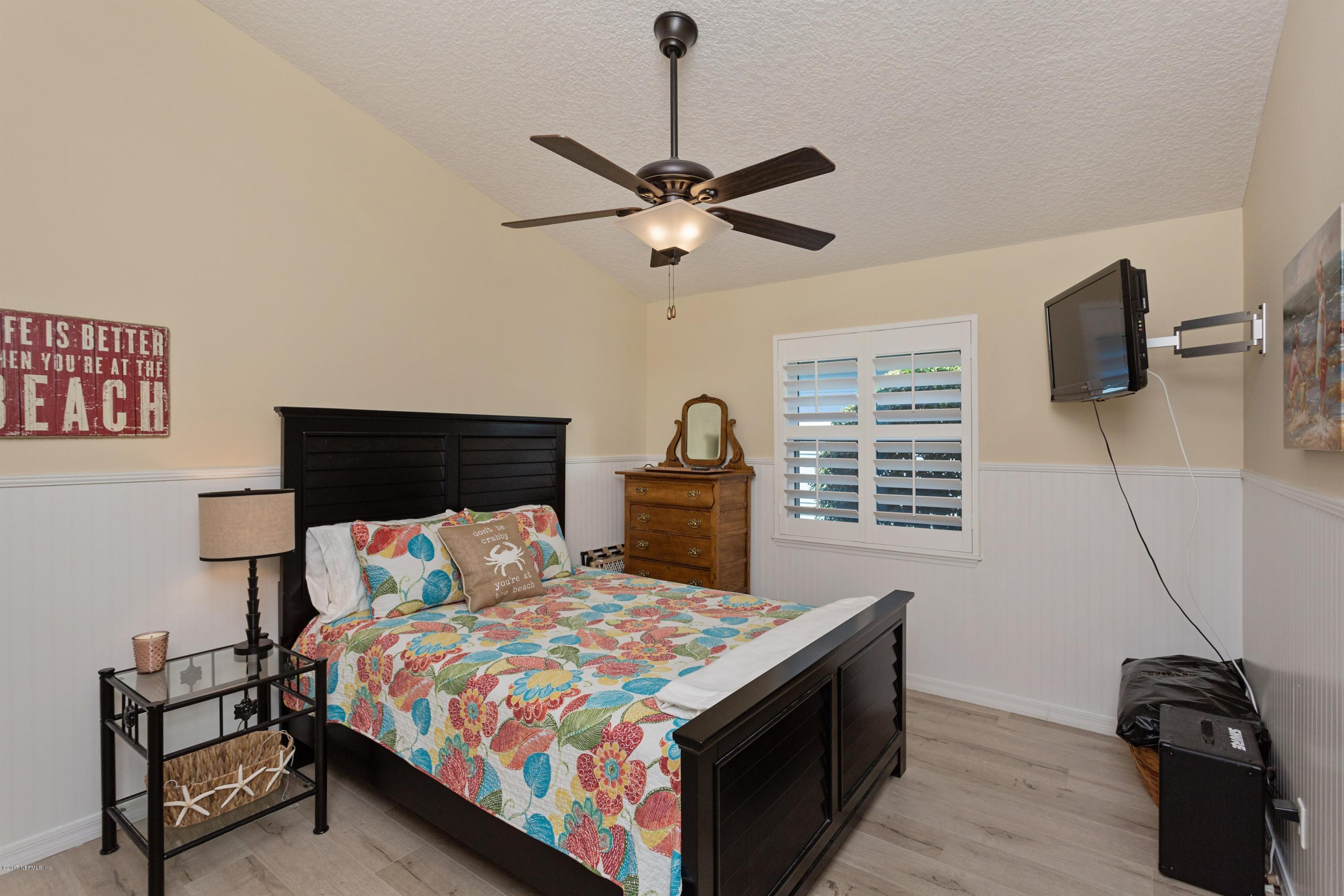 160 Patrick Mill Circle Ponte Vedra Beach, FL 32082 - Photo 15 of 23 a bedroom with a bed and a flat tv screen