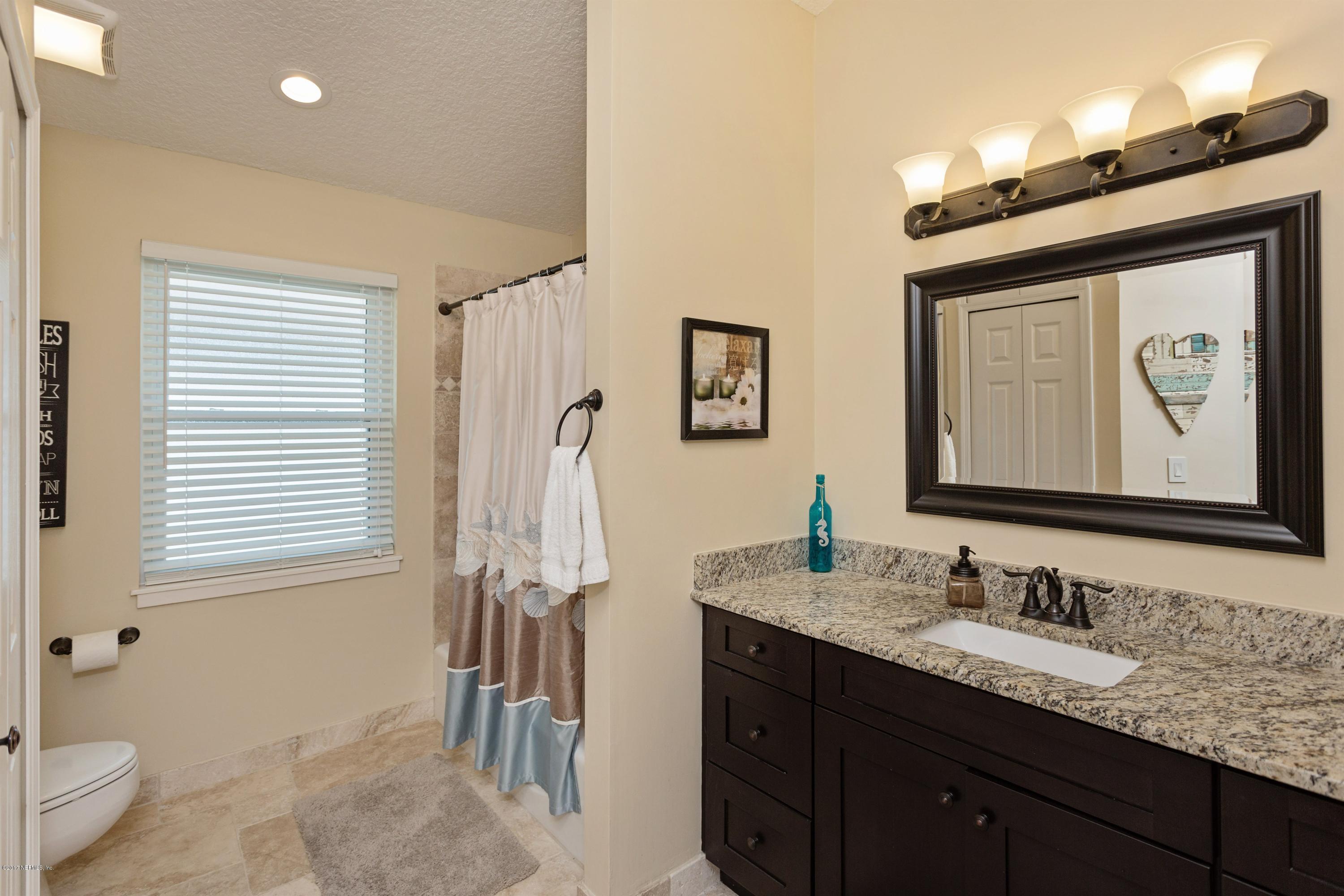 160 Patrick Mill Circle Ponte Vedra Beach, FL 32082 - Photo 16 of 23 a bathroom with a granite countertop sink and a mirror