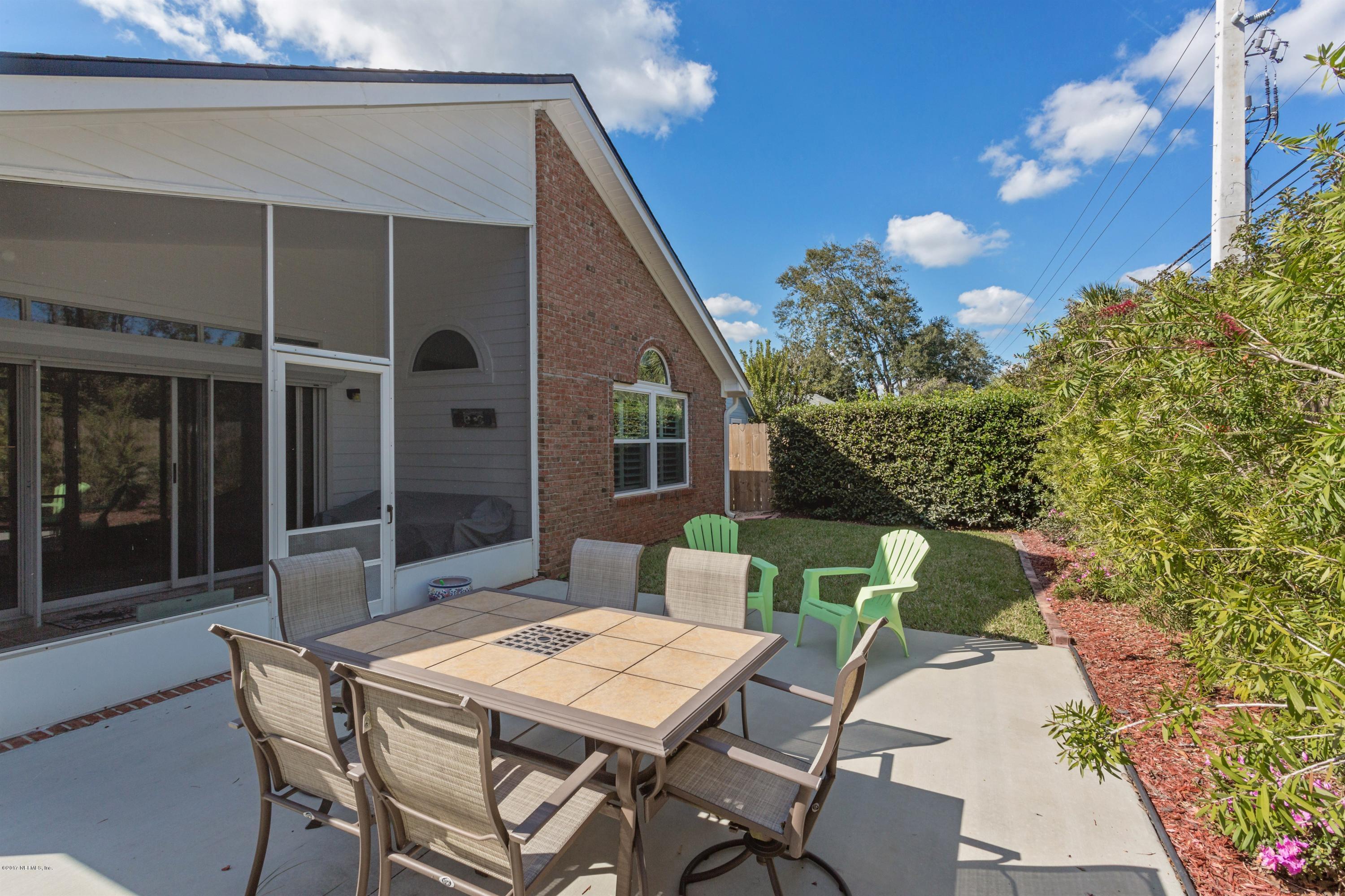 160 Patrick Mill Circle Ponte Vedra Beach, FL 32082 - Photo 19 of 23 a patio with table and chairs and potted plants