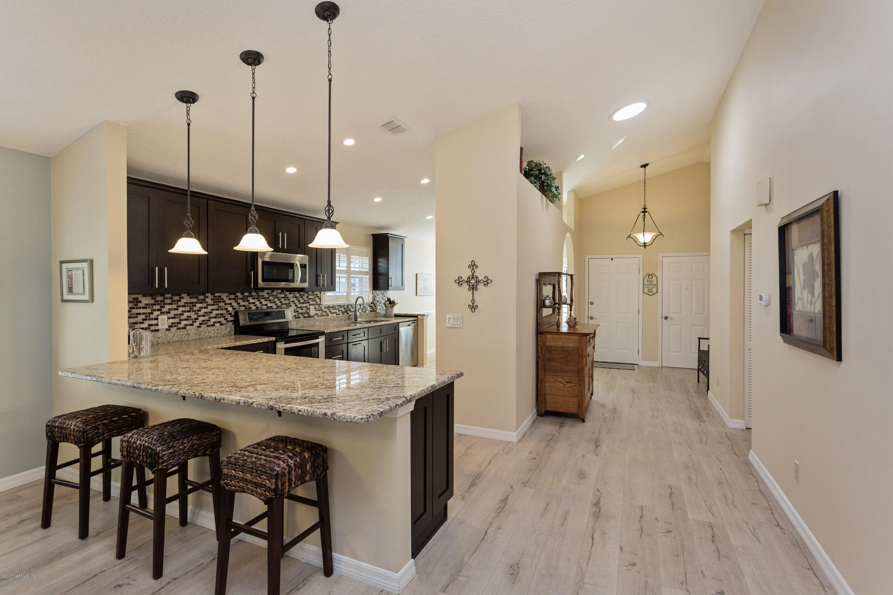160 Patrick Mill Circle Ponte Vedra Beach, FL 32082 - Photo 2 of 23 a large kitchen with a table and chairs