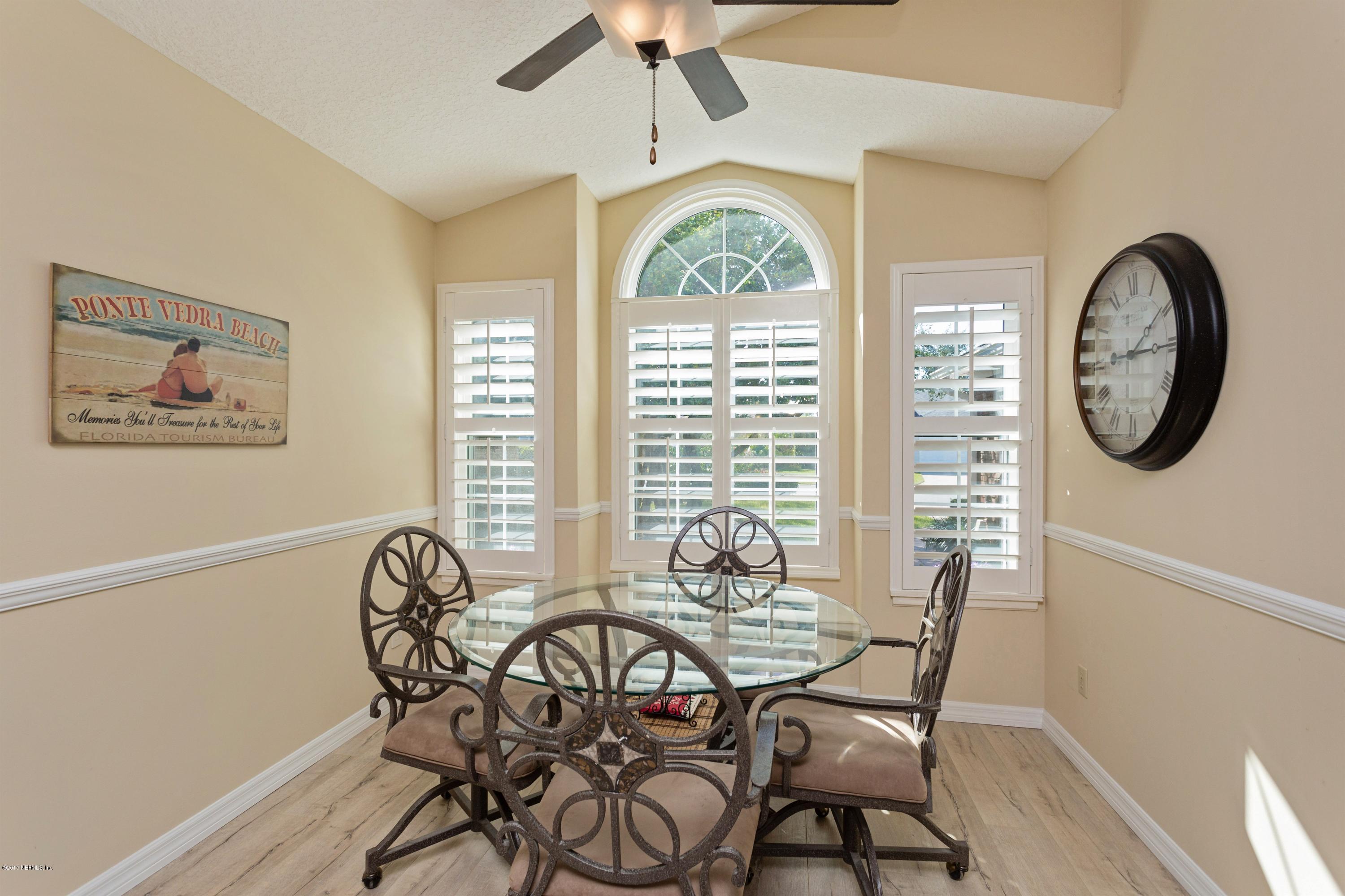 160 Patrick Mill Circle Ponte Vedra Beach, FL 32082 - Photo 4 of 23 a view of a dining room with furniture window and wooden floor