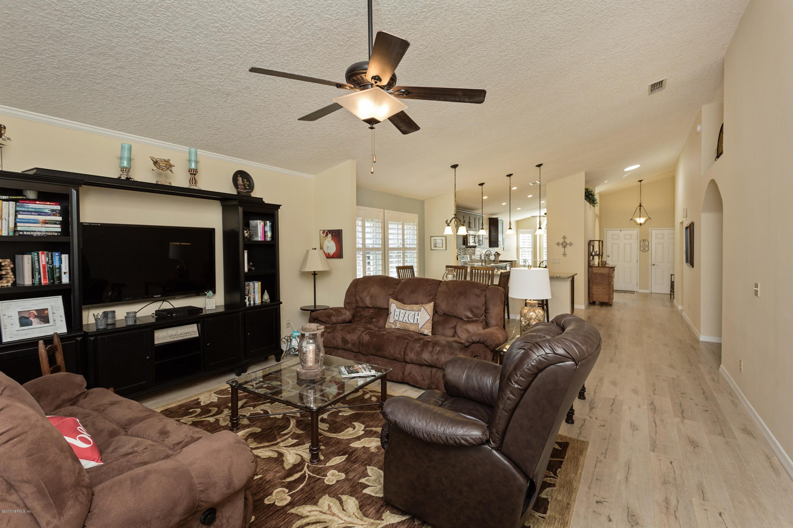160 Patrick Mill Circle Ponte Vedra Beach, FL 32082 - Photo 8 of 23 a living room with furniture and a flat screen tv