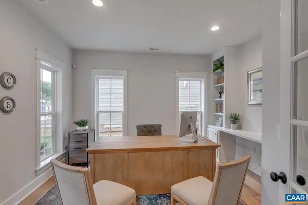 a living room with furniture and windows