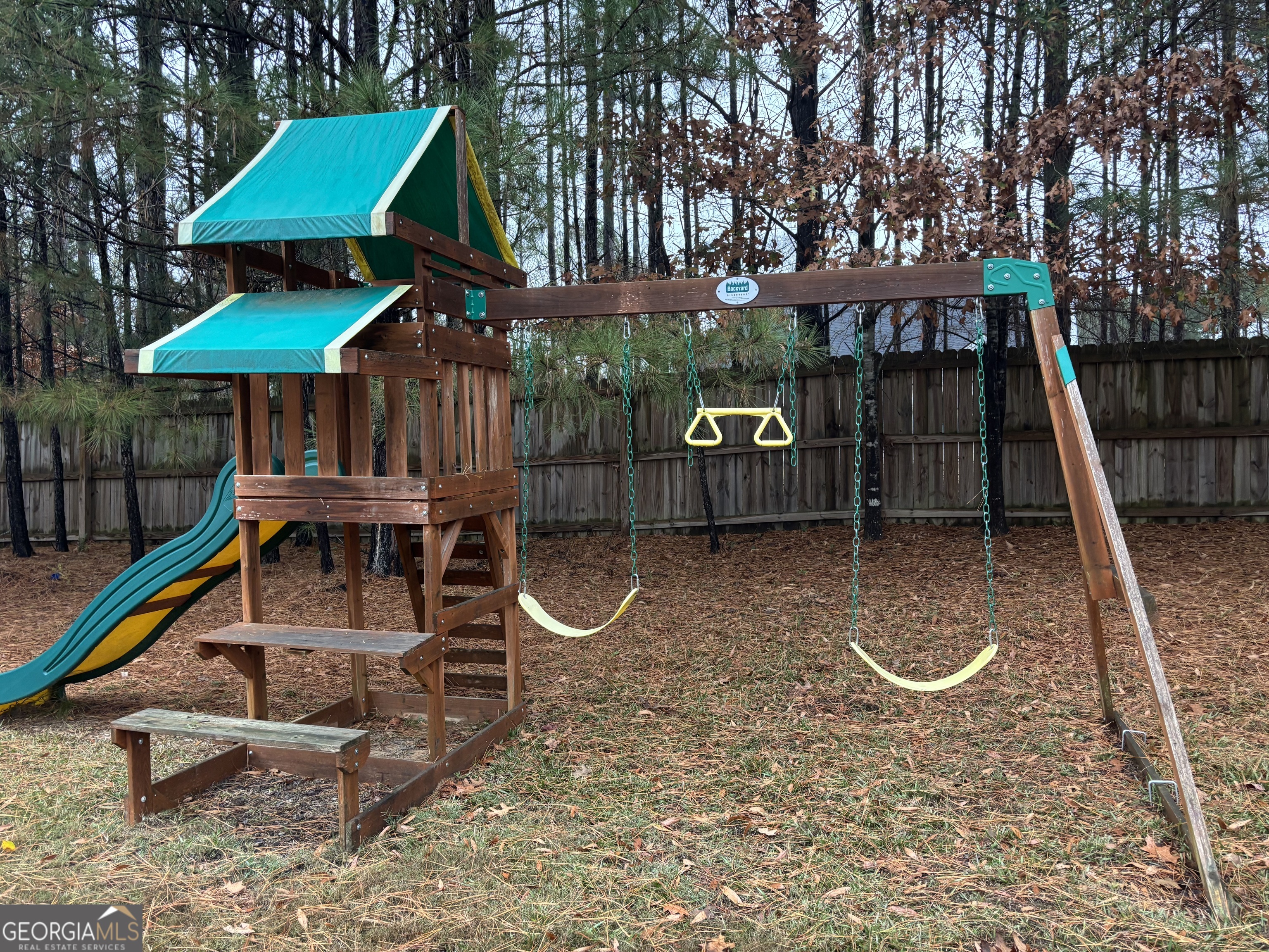 63 Highlander Trail Southwest Rome, GA 30165 - Photo 33 of 49 a view of a chairs and table in the backyard